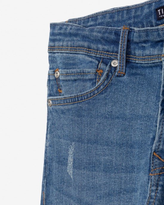 Джинсы skinny fit синего цвета с потертостями 